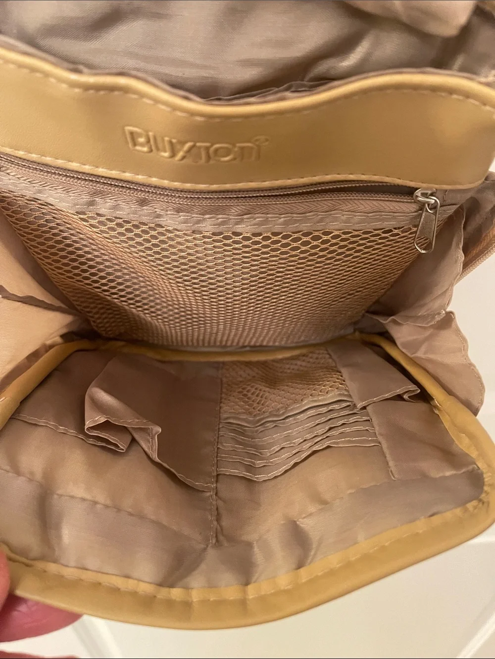 Buxton tan crossbody sling backpack
